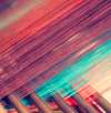 Close-up of colorful threads on a loom in a fabric mill